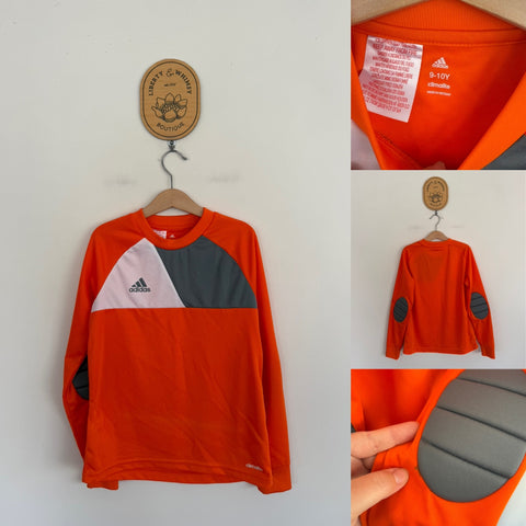 Adidas Climalite l/s orange shirt Sz 9-10 as new, dot on elbow pad as pictured